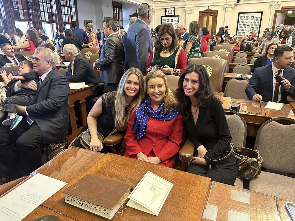 State Representative Terri Leo Wilson takes the Oath of Office surrounded by her family during the Opening Day Ceremony.
